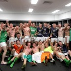 The Irish team celebrate in the dressing room.