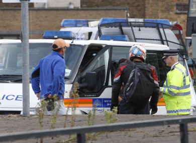 Police pictured at the scene in Tottenham Hale, North London, where Mark Duggan was shot dead on 4 August