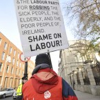Labour Party card holding member Peter Wall from Joe Costello's constituancy in North Dublin City protests on his own outside the Dail today ahead of the Minister of Finance, Michael Noonan TD, presenting the Budget 2012 to the Dail. Photograph: Sasko Lazarov/Photocall Ireland