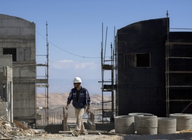 A Palestinian works at a construction site in the Jewish West Bank settlement of Maale Adumim, near Jerusalem