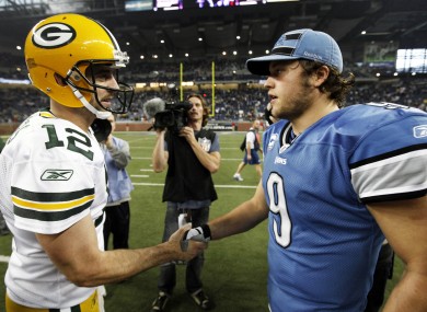 Green Bay Packers quarterback Aaron Rodgers (12) and Detroit Lions quarterback Matthew Stafford (9) shake hands after the Packers' Thanksgiving Day win in Detroit.