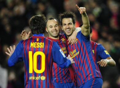 Fabregas celebrates scoring with his Barca teammates.