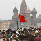 Protesters wave a red flag, a symbol of revolution (AP Photo/Alexander Zemlianichenko)