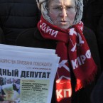 A demonstrator wears a red scarf with the Communist party insignia and a hat reading USSR, in the Siberian city of Novosibirsk (AP Photo/Ilnar Salakhiev)
