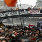 Protesters with a huge banner reading