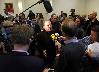Archbishop of Utrecht Wim Eijk, centre, speaking to reporters after the revelations that up to 20,000 Dutch children were abused by 800 clerical and lay staff in Catholic institutions since 1945.