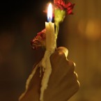 A Yemeni girl holds a candle and a flower during a rally to commemorate the first anniversary of Tunisian Mohamed Bouazizi's death – which sparked the so-called Arab Spring. (AP Photo/Hani Mohammed)