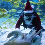 A diver dressed as Santa Claus performs under water at Tianjin Polar Ocean. (Photo by Su Li/ChinaFotoPress)