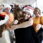Paige Kinstler, 14, from Florida meets family at Southwest Florida International Airport Thursday, 22 December.
(AP Photo/Naples Daily News, Tristan Spinski) 
