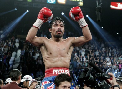 Manny Pacquiao celebrates beating Juan Manuel Marquez in November.