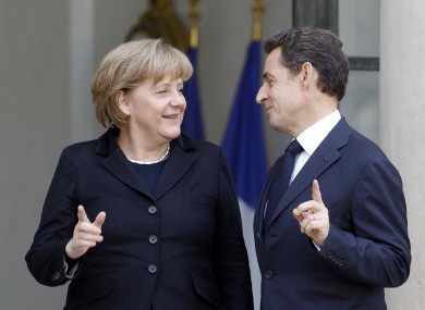 Who's number one? Merkel and Sarkozy pictured in December
