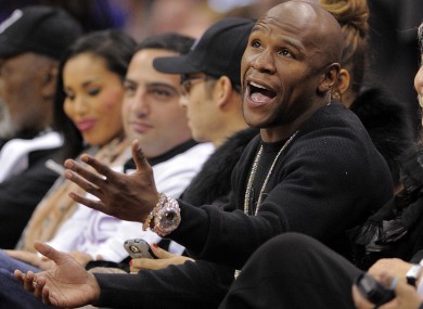 Mayweather talks to a referee as he watches the Los Angeles Clippers' NBA basketball game against the Chicago Bulls last week.