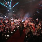 A general view of the arena as Andy Hamilton arrives for his match during the Ladbrokes.com World Darts Championship Final at Alexandra Palace, London.