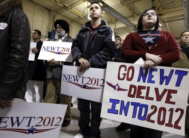 Supporters of Newt Gingrich gather at his Iowa campaign headquarters yesterday