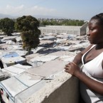 Nadia Almeda who was rehoused by Irish NGO Concern  looks down on a temporary camp in Port-au-Prince - 550,000 people in Haiti still live in them two years after the earthquake. Image: Niall Carson/PA Wire