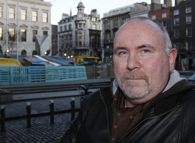 Frank McQuade in front of the Occupy camp