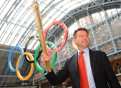 London 2012 chairman Sebastian Coe holding the Olympic torch in London