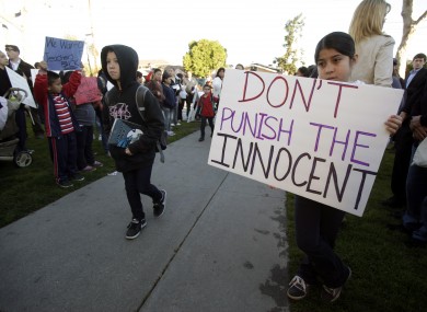 A student holding a sign outside the Miramonte Elementary School earlier today
