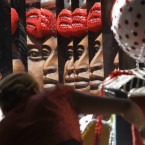 A woman works on a carnival float at the Mocidade Independente de Padre Miguel samba school in Rio de Janeiro, Brazil. (AP Photo/Silvia Izquierdo)