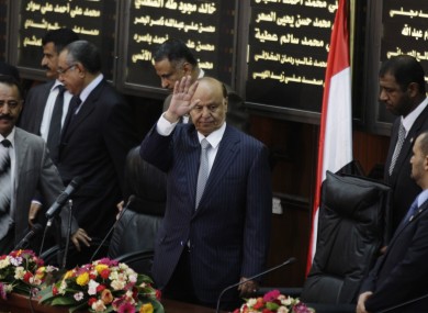 Yemen's newly elected President Abed Rabbu Mansour Hadi waves as he arrives to the Parliament in Sanaa earlier today