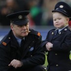 Inspector John Ferris chats with Dylan Steele, aged seven, who won a competition to be a Garda for the day, during the RBS Six Nations match between Ireland and Italy at the Aviva Stadium, in Dublin. Pic: PA images