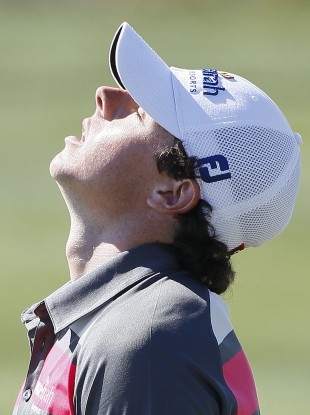 Rory McIlroy reacts after missing a putt on the eighth green.