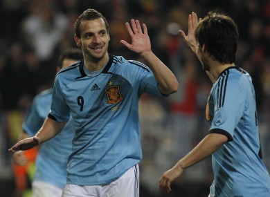 Soldado celebrates his hat-trick with David Silva.