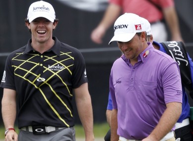 Rory McIlroy and Graeme McDowell share a joke yesterday.