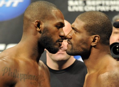 Jon Jones, left, stares down Rampage Jackson.
