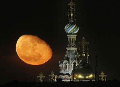 The moon rises above the Savior of Spilled Blood Cathedral in downtown St.Petersburg, Russia