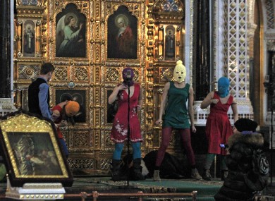 Pussy Riot performing at the cathedral in Moscow in February before they were taken away by security guards