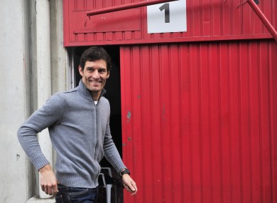 Mark Webber of Australia and Red Bull Racing walks in the paddock during a test session at the Montmelo racetrack.