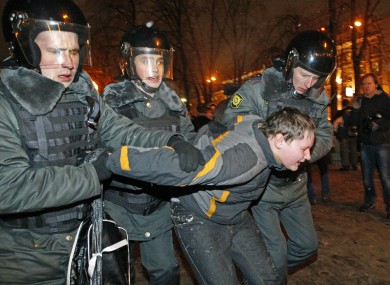 Police detain a protester after a rally in Moscow last night