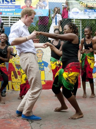 Prince Harry dancing in his blue suede shoes with Chantol Dorner in Jamaica.