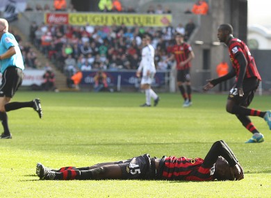 Down and... out? Mario Balotelli lies forlorn