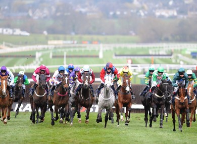 Runners and riders in the JLT Specialty Handicap Chase on Centenary Day, during the Cheltenham Festival.