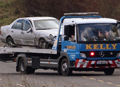 The off-duty Garda's car being taken from the scene earlier today.