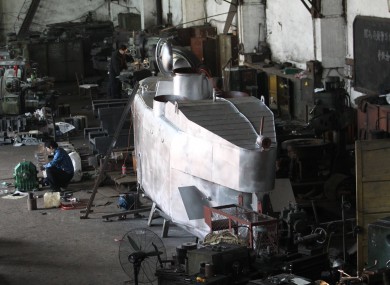 A submarine takes shape in Zhang Wuyi's workshop