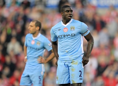Micah Richards and Paolo Zabaleta look dejected