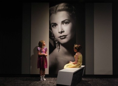 Amy Russell (8) and Abbey Goldings (6) look at a picture of Grace Kelly at the IMC Tallaght