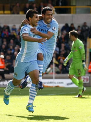 Aguero and Tevez celebrate the opener.