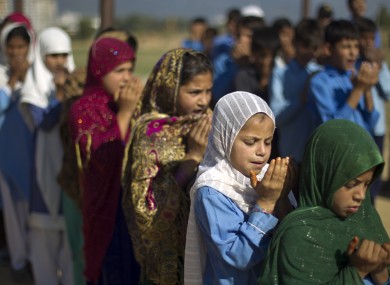 File photo of schoolchildren attending a school in Islamabad. A 13-year-old Pakistani boy set himself on fire, and later died, after his parents could not afford a new school uniform for him.