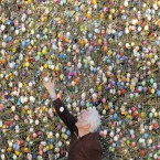 Volker Kraft decorates a tree with 10,000 Easter eggs in his garden in Saalfeld, Germany, Wednesday, March 21, 2012. The Kraft family has been decorating their tree for Easter for more than forty years. (AP Photo/Jens Meyer)