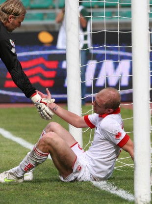Masiello avoids eye contact with his teammate after scoring an own goal against Lecce.
