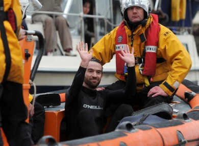 Trenton Oldfield is removed from the water by the RNLI.