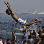 A Filipino dives at the polluted waters of Manila's bay, Philippines. (AP Photo/Aaron Favila)