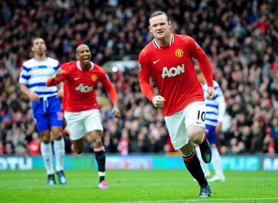 Wayne Rooney celebrates his penalty... and quite possibly a 20th United title