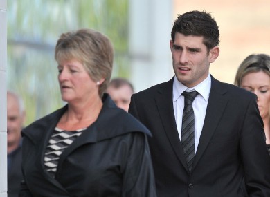 Sheffield United and Wales striker Ched Evans (centre) arrives at Caernafon Crown Court this morning.