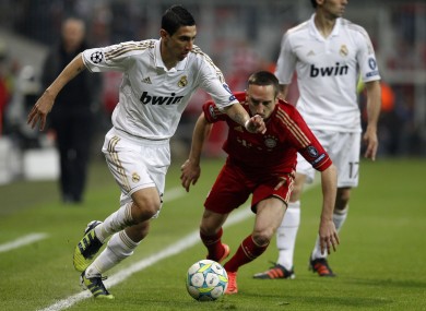 Madrid's Angel Di Maria, left, and Bayern's Franck Ribery challenge for the ball.