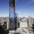 One World Trade Center, now up to 100 floors, rises above the lower Manhattan skyline and the National September 11 Memorial. The tower is scheduled to be completed in 2013. (AP Photo/Mark Lennihan)